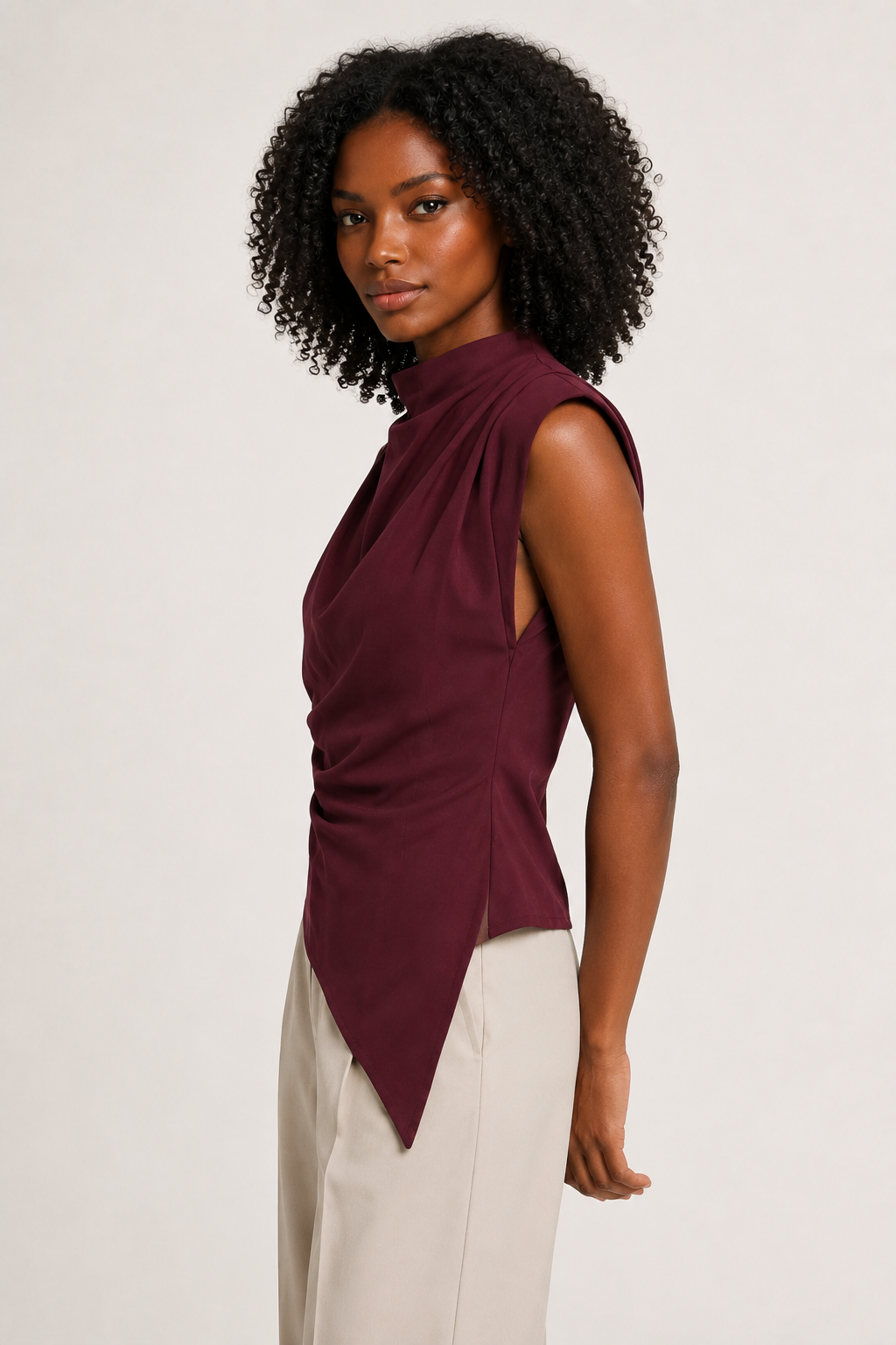 Burgundy sleeveless draped asymmetric top, side view