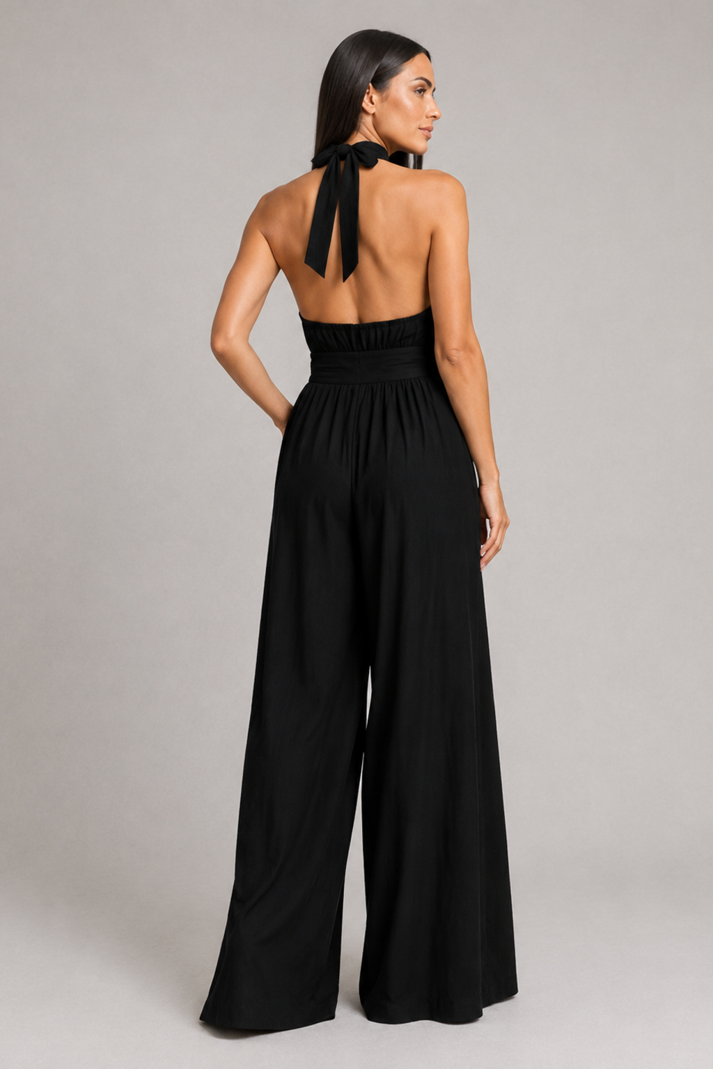 Black sleeveless halter-neck wide-leg jumpsuit, back view