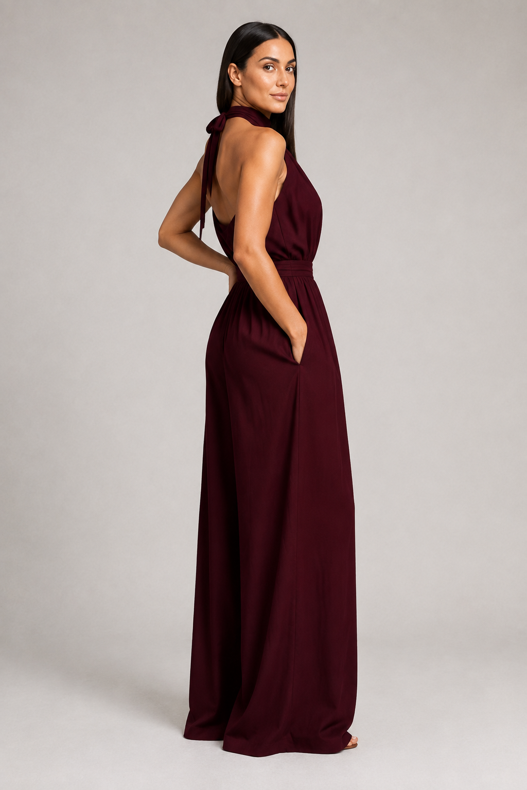 Burgundy sleeveless halter-neck wide-leg jumpsuit, side view
