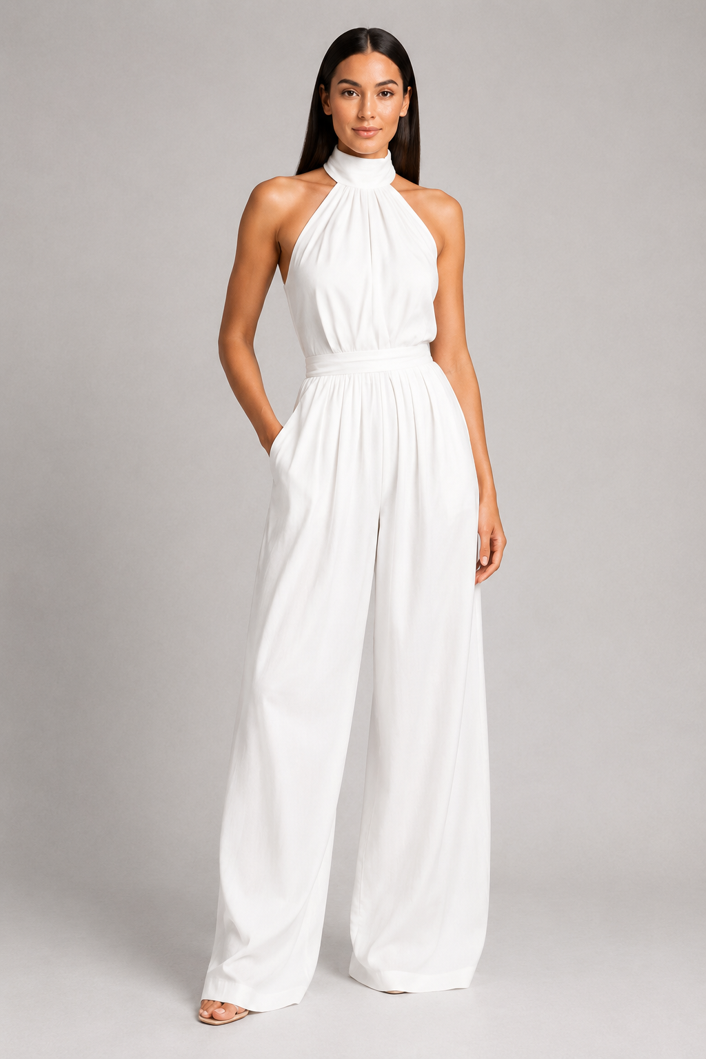 White sleeveless halter-neck wide-leg jumpsuit, front three-quarter view