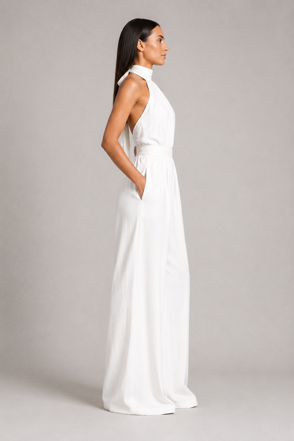 White sleeveless halter-neck wide-leg jumpsuit, side view
