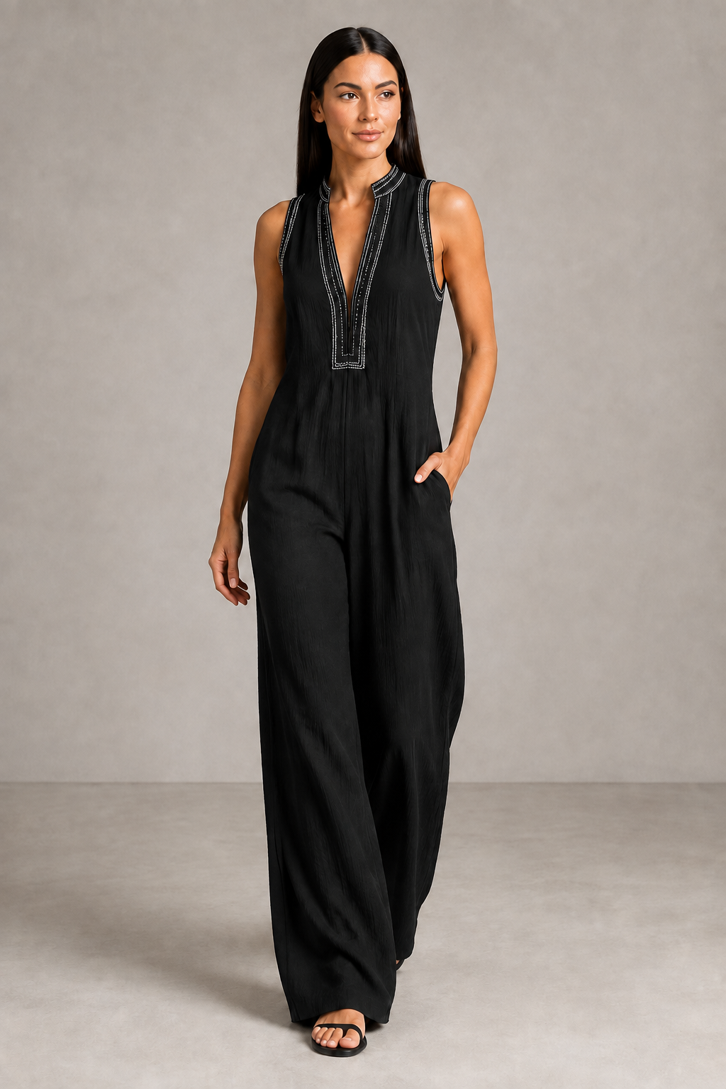Sleeveless High-Neck Zip Jumpsuit in Black, front three-quarter view