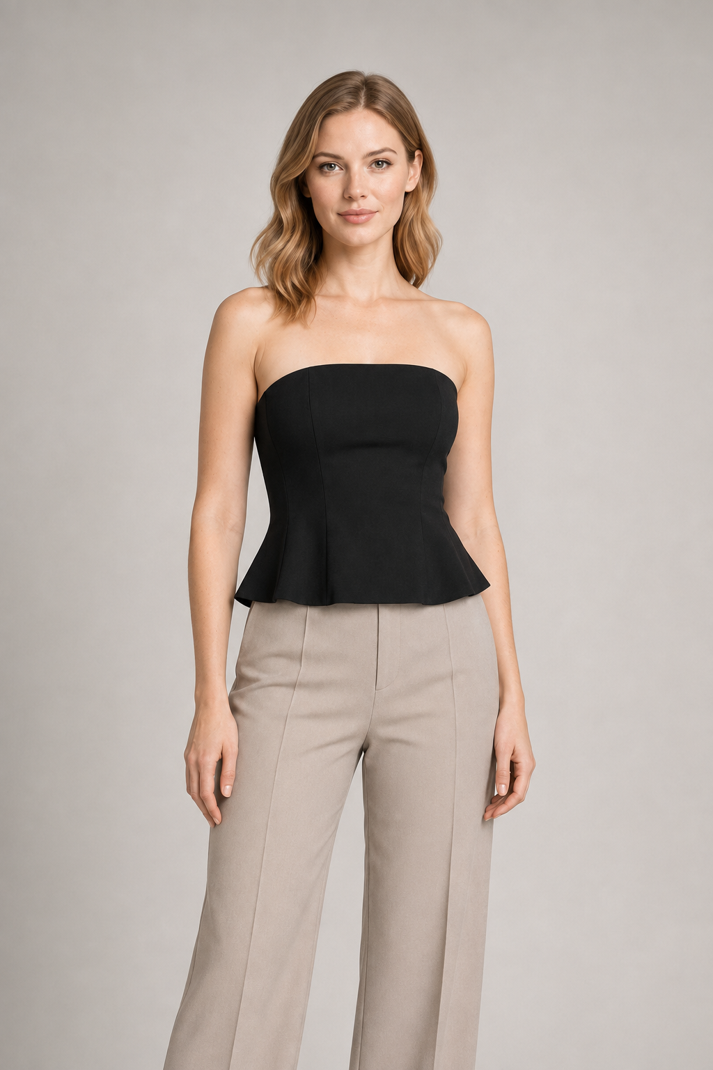 Strapless Corset Top with Flared Hem in Black, front three-quarter view