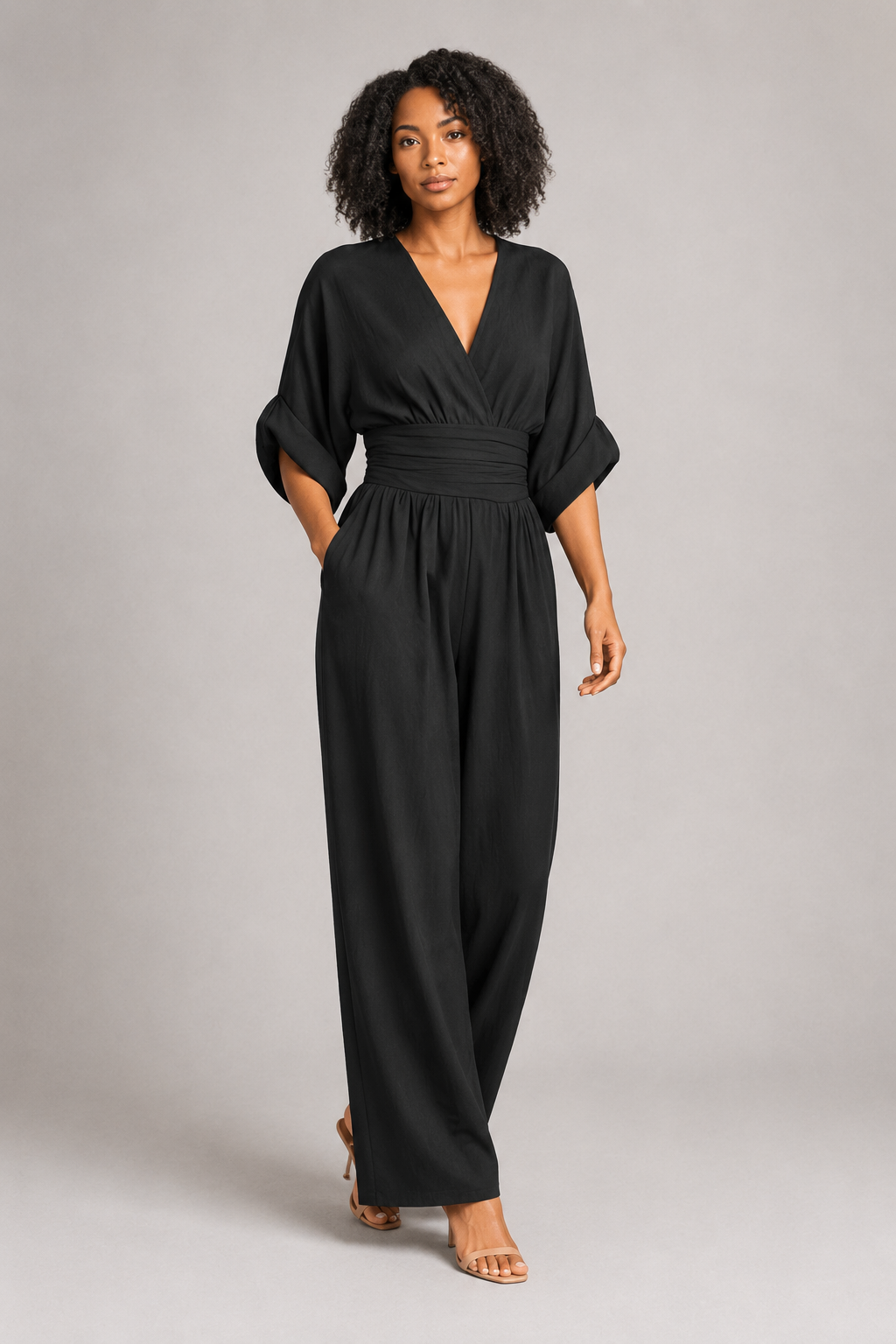 V-Neck High-Waisted Wide-Leg Jumpsuit in Black, front three-quarter view