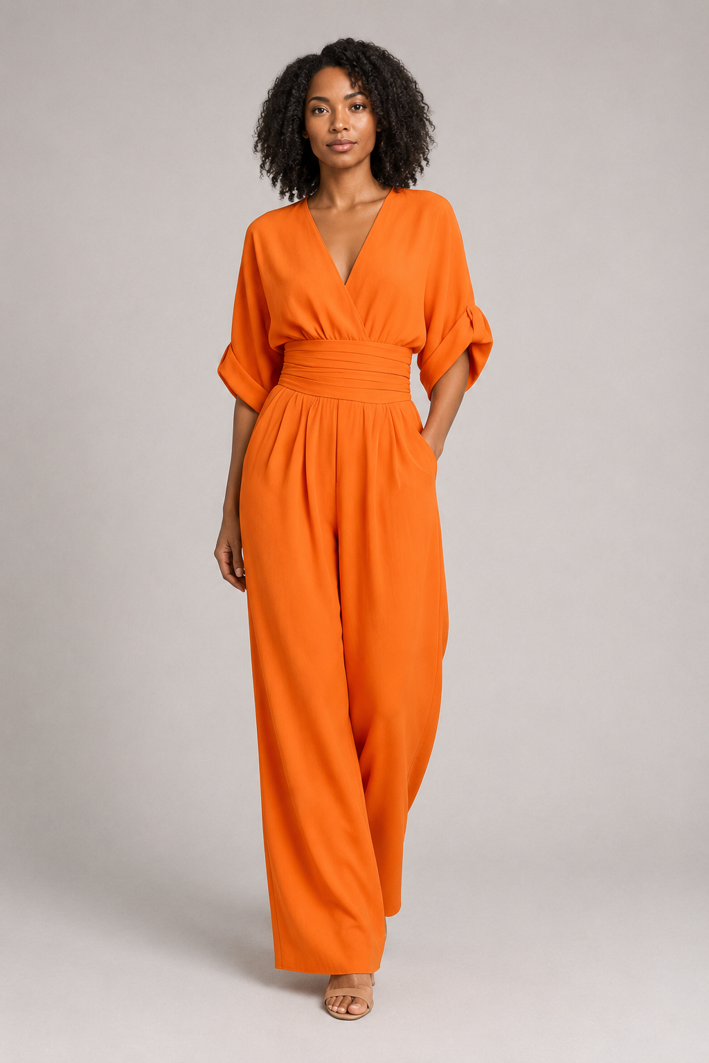 V-Neck High-Waisted Wide-Leg Jumpsuit in Orange, front three-quarter view